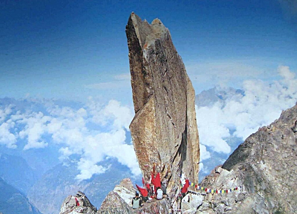 "Kinner Kailash peak with the sacred Shivlingam rock formation, surrounded by snow-capped mountains and rugged Himalayan terrain in Himachal Pradesh."